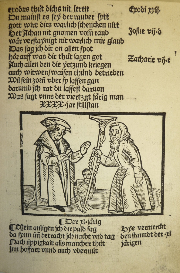 Ein Blatt Papier mit gedrucktem Text in einer fremden Sprache, mit zwei Männern im Hintergrund, möglicherweise aus einem Lehrbuch.