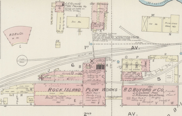 Ein detailliertes altes Stadtplanbild, das zahlreiche Gebäude, Straßen und Textbeschriftungen zeigt.