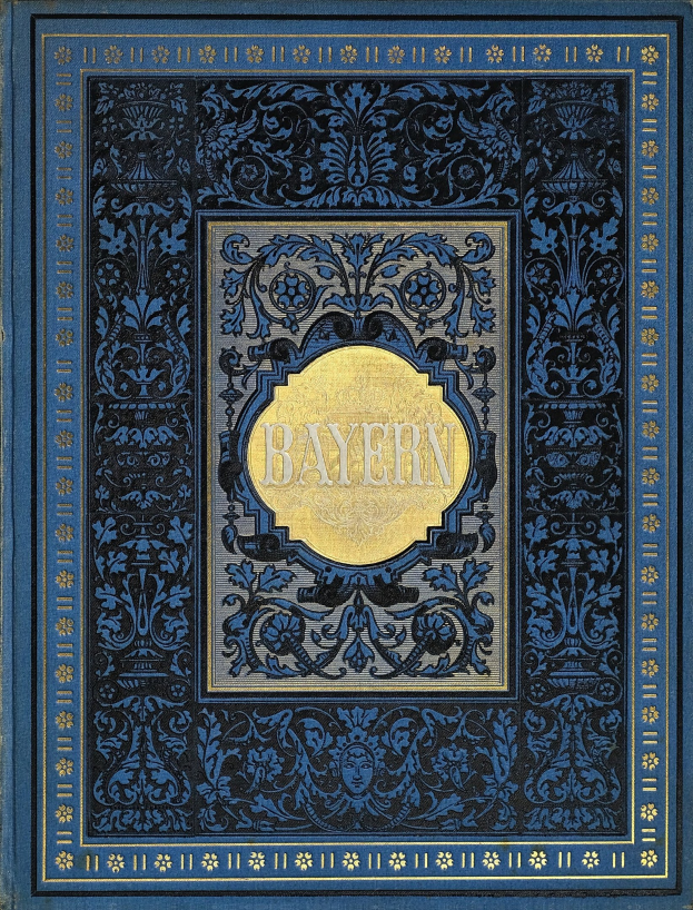 Ein blau-goldenes Buch mit dem Wort "Bayern" darauf, das mit detailreichen Verzierungen geschmückt ist.