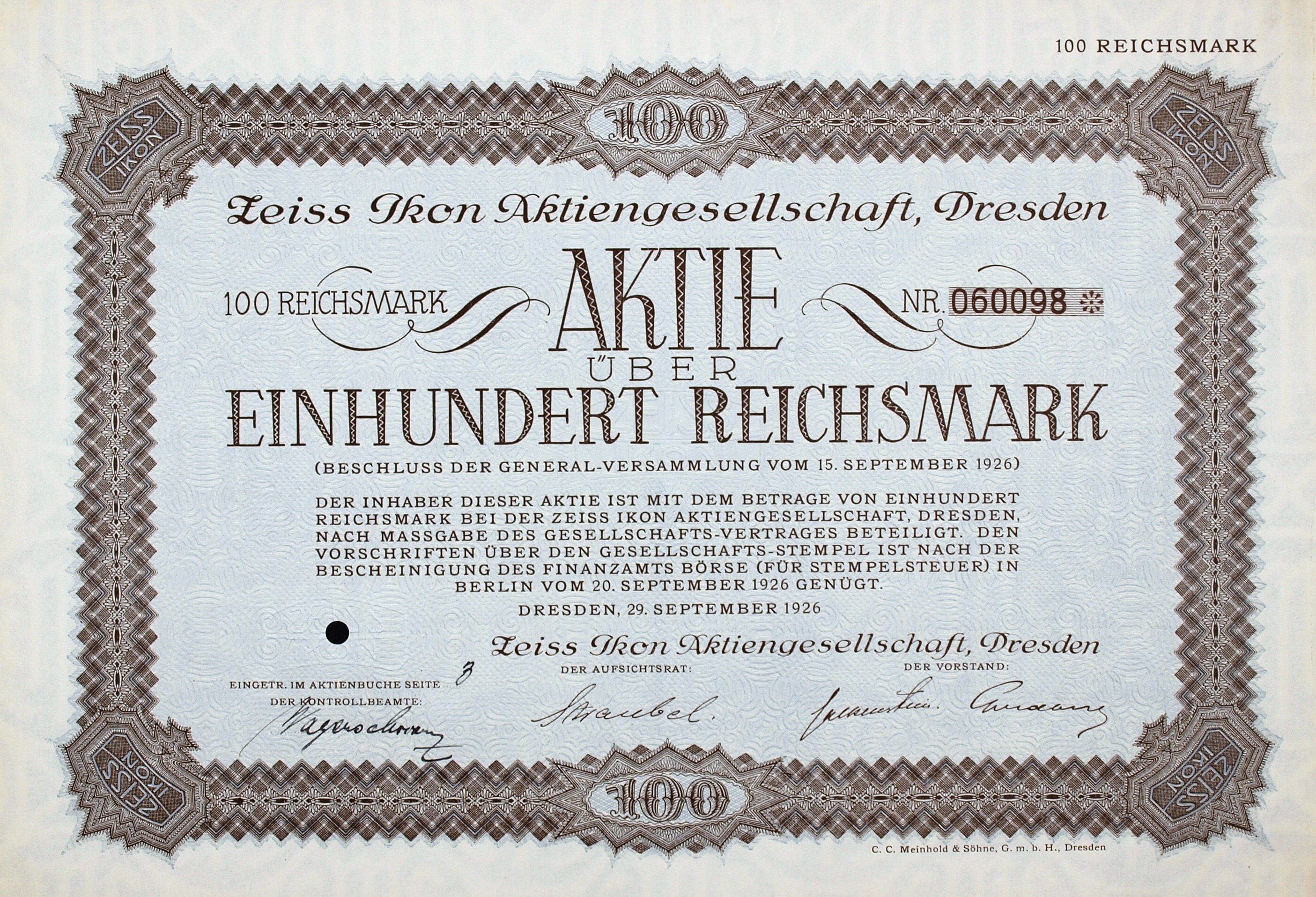 Alter deutscher Aktienchein für 100 Reichmarks mit schwarzem Rand und gedrucktem Text.