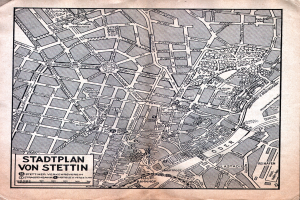 Ein detaillierter alter Stadtplan von Stuttgart auf Papier, der Straßen, Gebäude und Sehenswürdigkeiten zeigt, mit zusätzlichem Text.